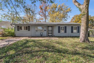 Ranch-style home with a front lawn | Image 1