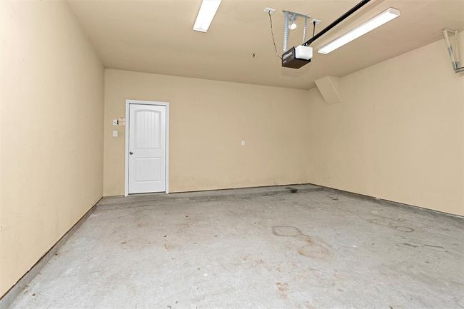 The home includes a spacious 2-car attached garage with an automatic door opener for added convenience and easy access. | Image 22