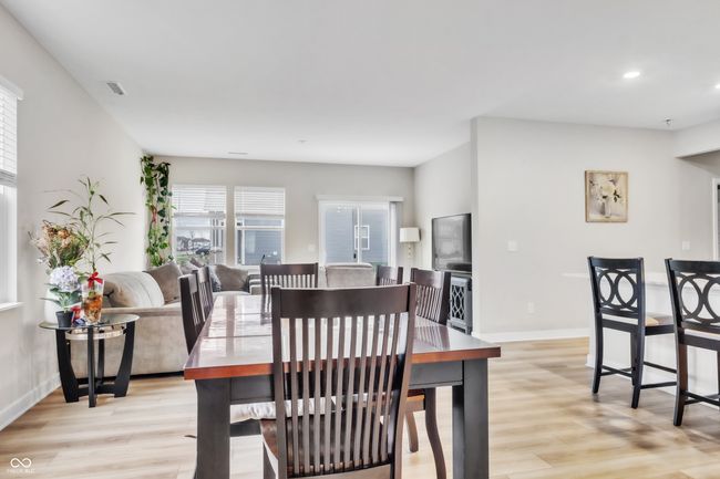 dining space with baseboards, light wood finished floors, and recessed lighting | Image 4