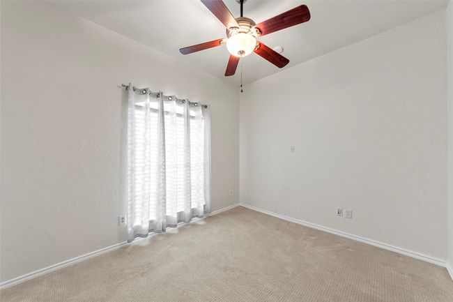 Spare room with a ceiling fan, baseboards, and light carpet | Image 29