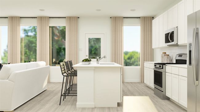 Kitchen featuring stainless steel appliances, plenty of natural light, and light wood-style flooring | Image 8