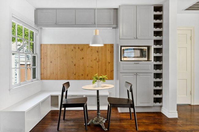You'll love this built-in breakfast nook with windows overlooking the peaceful backyard. | Image 8
