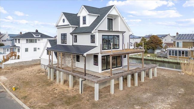 Back of property with a water view | Image 9