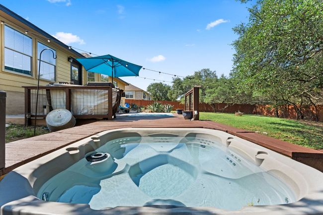 View of swimming pool featuring a deck | Image 23