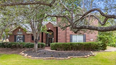 Discover the epitome of elegance and comfort in this beautiful home, perfectly nestled on a heavily treed lot right at the #17 teebox of the prestigious Yaupon Golf Course. | Image 2