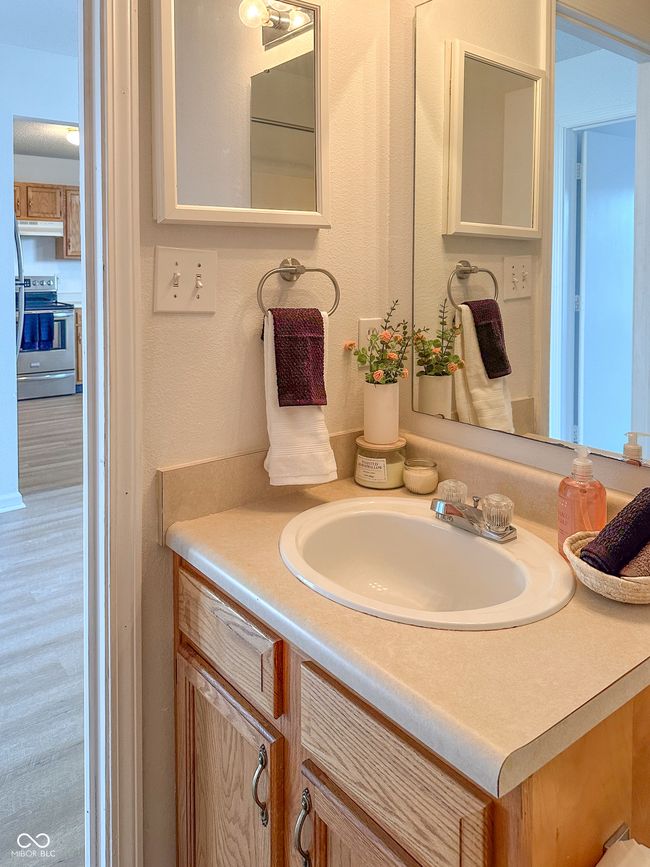 bathroom with vanity | Image 19