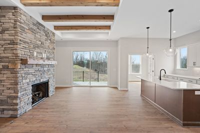 Family and Dining space. Photo is of a Damien plan from another community and is a likeness to the Damien being built on homesite 13 in Bear Creek Overlook. | Image 3