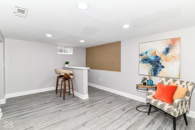 sitting room featuring recessed lighting, wood finished floors, and baseboards | Image 28