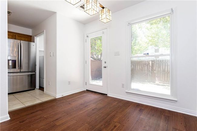 Entryway featuring wood finished floors and baseboards | Image 9