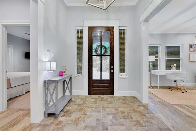 Welcoming open-concept entry with a versatile dining/flex room on the left. | Image 8