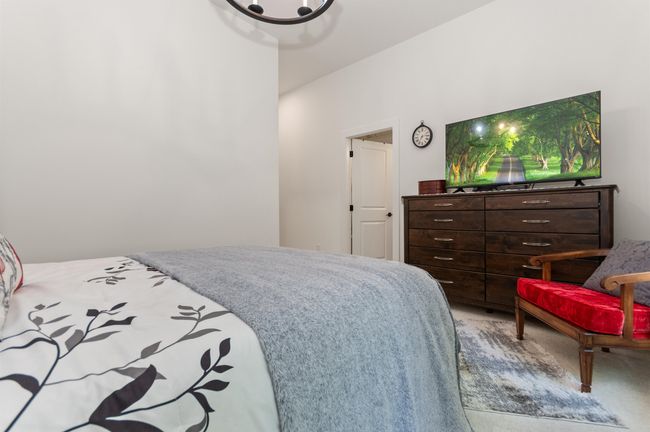 Bedroom with carpet flooring | Image 23
