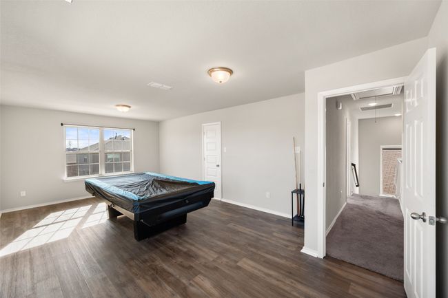 Rec room featuring pool table, baseboards, attic access, and dark wood finished floors | Image 14