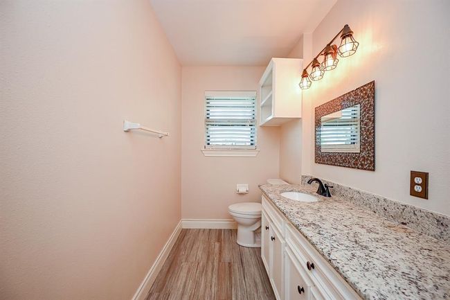 The current guest bathroom is a renovated former full bathroom and is conveniently accessible to all of the downstairs living spaces | Image 13