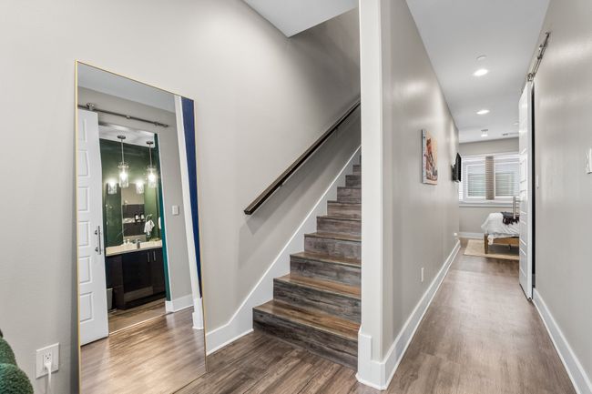 Stairs to the top floor extra room and entrance to patio | Image 20