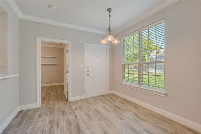 Dining area showing back door | Image 11