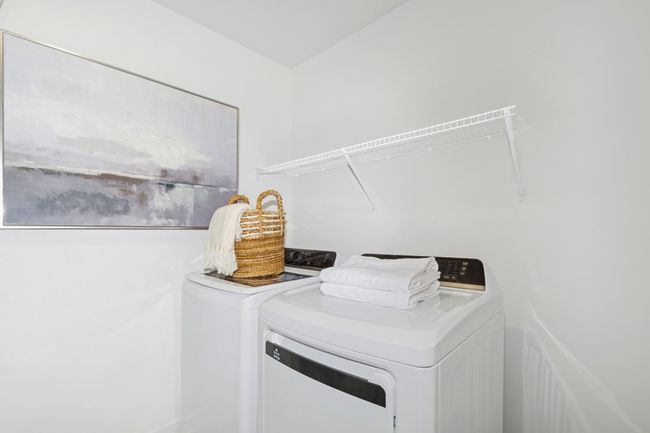(Photo of decorated model, actual home's finishes will vary) Centrally located on the upper level, along with the three bedrooms, this laundry room is sure to provide the ultimate convenience. | Image 18
