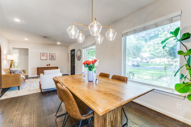 Dining room featuring recessed lighting & a beautiful chandelier | Image 6