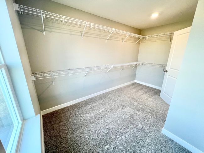 Actual home: Primary closet has plenty of space for even a fashion aficionado! | Image 27