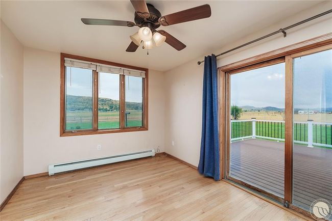 Dining room with patio door to the back deck | Image 16