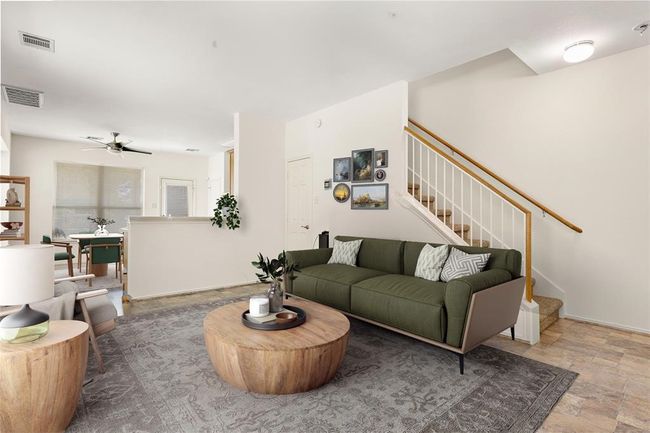 A cozy and welcoming living room that enhances the charm. | Image 6