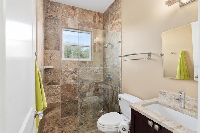 Guest cottage bathroom with step in shower | Image 73