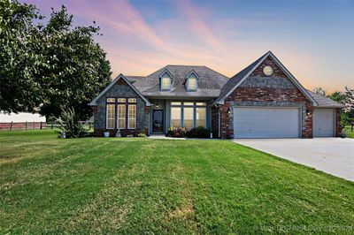 Brick and stone exterior 4 bed plus office 3 full bath 3 car garage .75 acre lot | Image 1