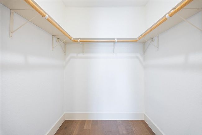 Spacious closet featuring wood finished floors | Image 7