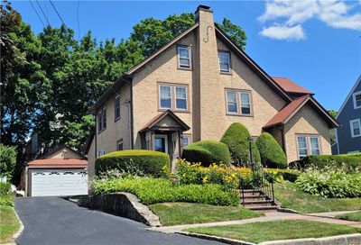 HIGHLANDS GEM! 2940 Sq. Ft. with 3 Br, + 2 HEATED rooms for guests on 3rd level; 3 FULL BATHS, 2 car Garage, large basement, patio, within walking distance to train. | Image 1