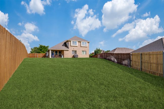 View from the back corner of the yard showing two large side yards. | Image 21