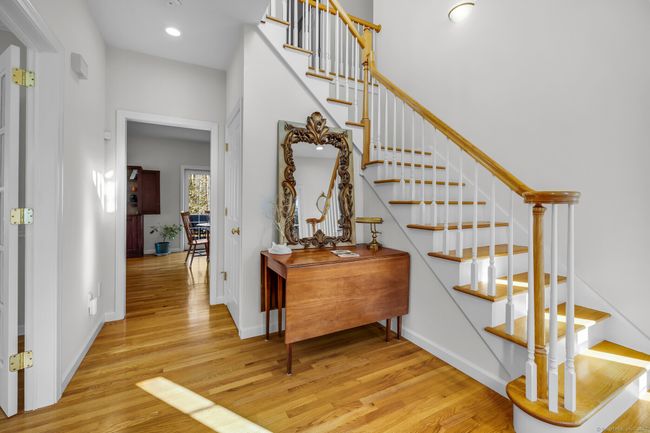 Front entry foyer flanked by formal living and dining room. Hardwood floors and 9-foot ceilings throughout the main level. | Image 4