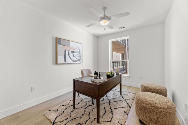 Office area featuring visible vents, baseboards, ceiling fan, and light wood-style floors | Image 9