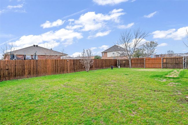 View of fenced backyard | Image 27