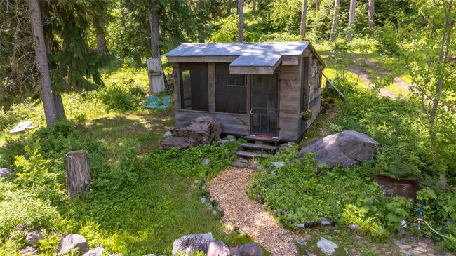 View of outdoor structure featuring a forest view | Image 71