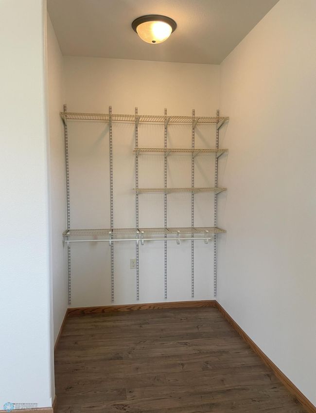 Accessible Walk-In Closet with Adjustable Shelving.jpg | Image 15