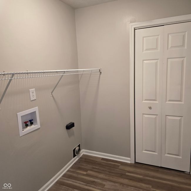 Nice laundry room with wiring shelving and a closet. New laundry box installed | Image 12