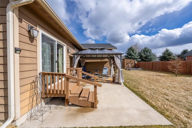 View of patio / terrace with a gazebo and a fenced backyard | Image 19