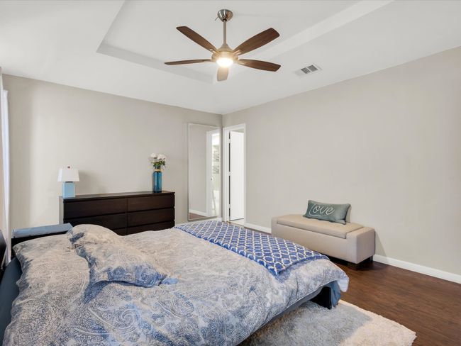 Bedroom with wood finished floors and a ceiling fan | Image 16