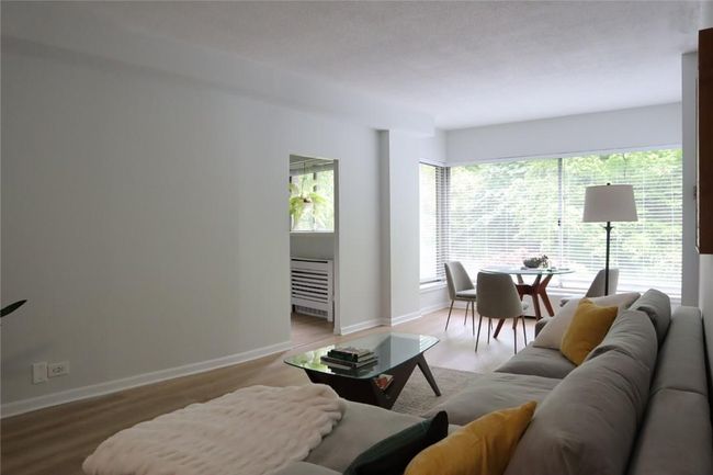 Living room with hardwood / wood-style floors | Image 14