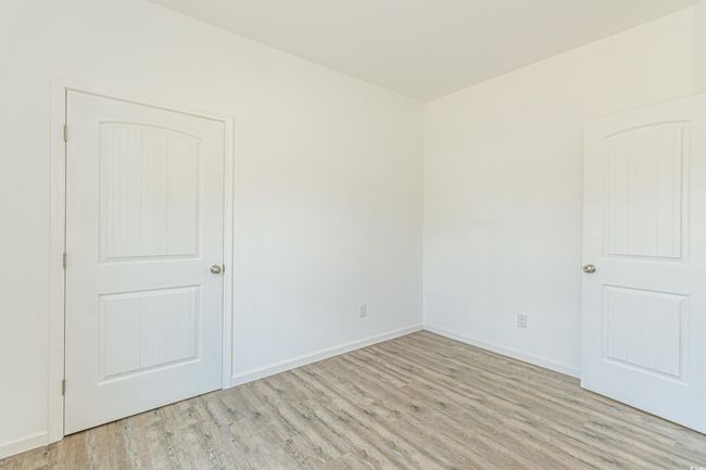 Unfurnished room with light wood finished floors and baseboards | Image 27