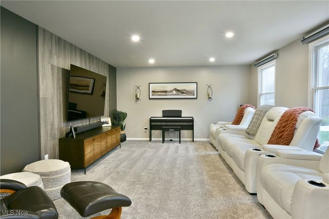 Living room with light carpet, recessed lighting, and baseboards | Image 9