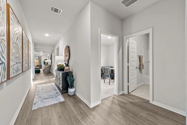 Hall with wood finished floors and baseboards | Image 24