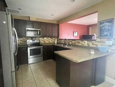 B - 820 28 St, Home with 4 bedrooms, 1 bathrooms and 3 parking in Wainwright AB | Image 3