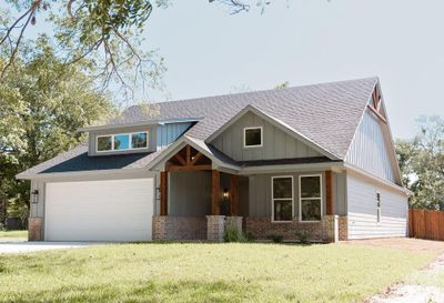 Craftsman house featuring a front lawn and a garage | Image 2