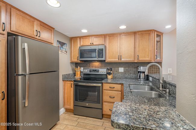 Updated Kitchen with Maple Wood Soft Close Cabinetry, Granite Countertops, Stainless Steel GE Appliances including Refridgerator, Dishwasher, Microwave, Electric Range & Oven | Image 14