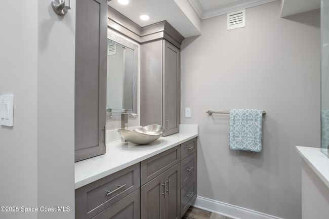 Primary bath has lots of cabinets. | Image 29