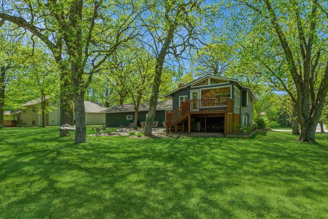 Backyard you have been dreaming of!! Under the three season porch and deck is a wonderful extra storage area! | Image 48