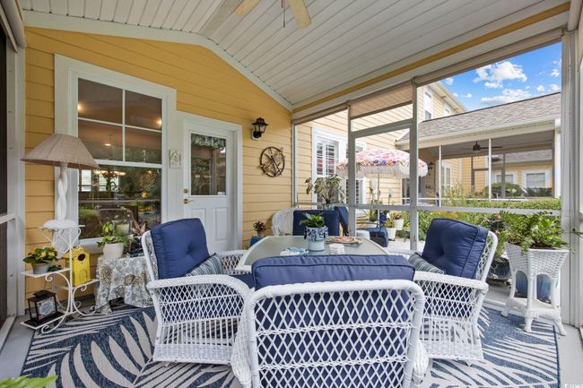 Sunroom with ceiling fan and lofted ceiling | Image 23