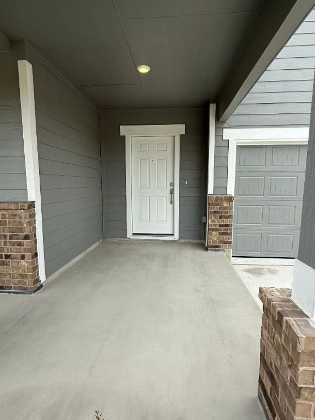 View of exterior entry with brick siding | Image 5