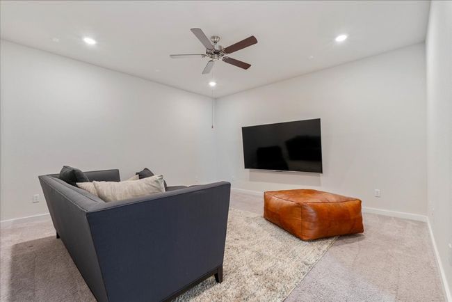 Living room with recessed lighting, a ceiling fan, and carpet floors | Image 29
