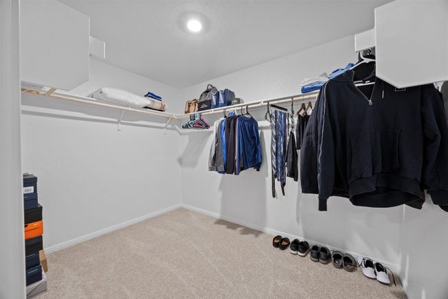 Spacious closet with carpet floors | Image 23
